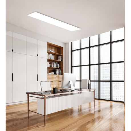 Jamessa LED Panel Light, 119.5 x 29.5cm rectangular white ceiling fixture with integrated LEDs, shown illuminated on an office ceiling above a desk and bookshelf.