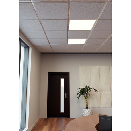 Two square Jamessa LED panel lights recessed into a grid ceiling, white finish, illuminating an office with a dark door, plant, and wooden table.