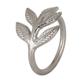 Janapur Napkin Ring in silver aluminium, a round band rising into a cast leaf sprig with veined detailing, shown against a plain white background.