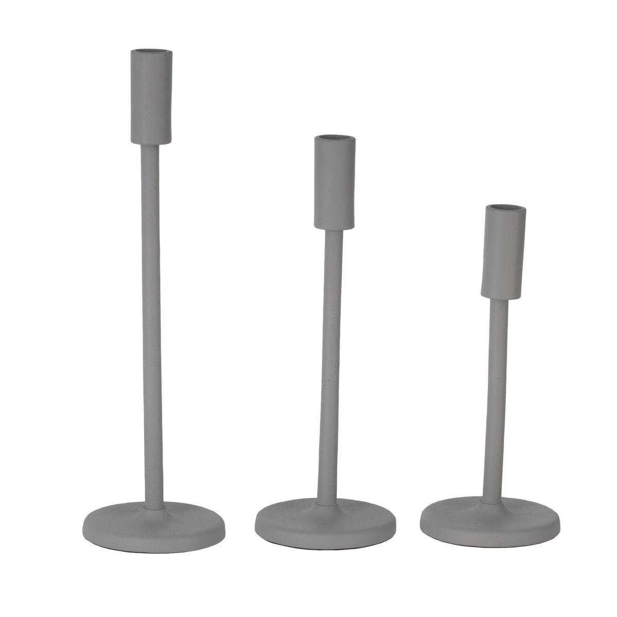 Jellicoe Candle Holder set in grey aluminium, three slim taper stands of varying heights with cylindrical candle cups and round flat bases, on a plain white background.