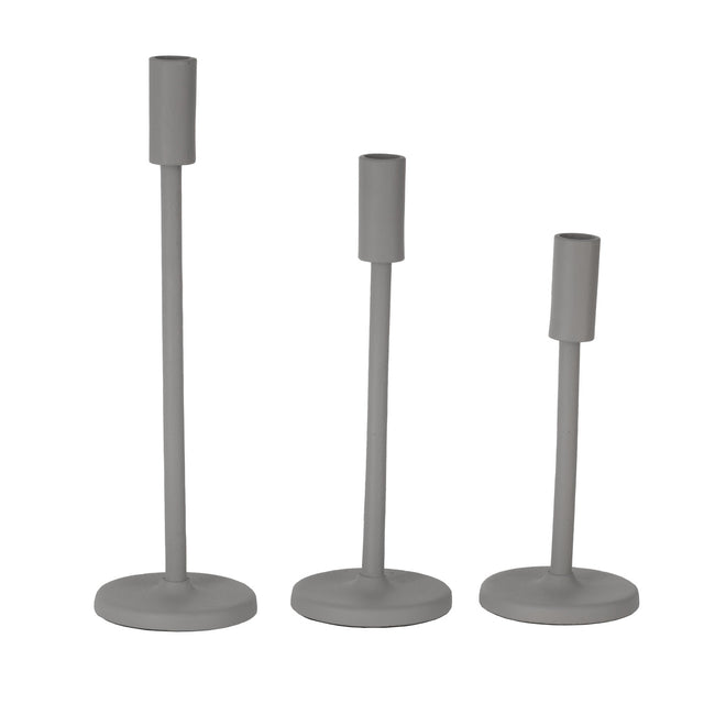 Jellicoe Candle Holder set in grey aluminium, three slim taper stands of varying heights with cylindrical candle cups and round flat bases, on a plain white background.