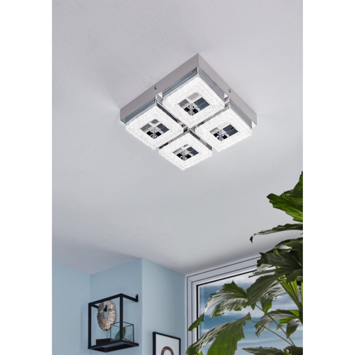 Jinelle LED 4 Light Flush Ceiling Light in chrome, with four square crystal-effect panels in a grid, mounted on a white ceiling in a hallway setting.