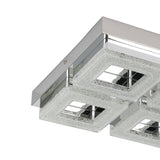 Jinelle LED 4 Light Flush Ceiling Light in chrome, close-up of two square LED panels with textured glass frames and mirrored chrome centres on a steel base, shown against a white background.