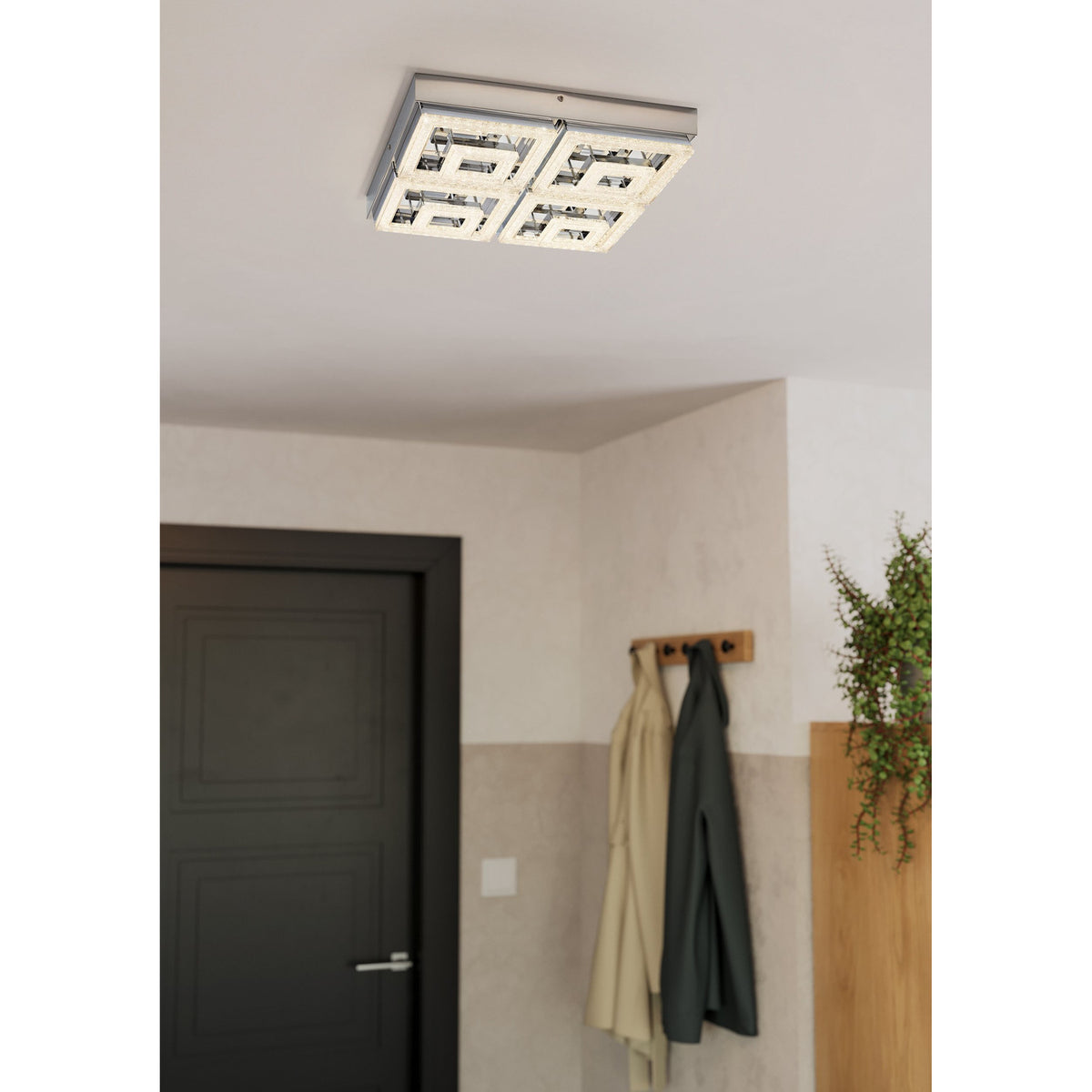 Jinelle LED flush ceiling light in chrome, square 52 x 52cm design with four crystal-effect square panels, shown mounted in a hallway near a dark door and coat hooks.