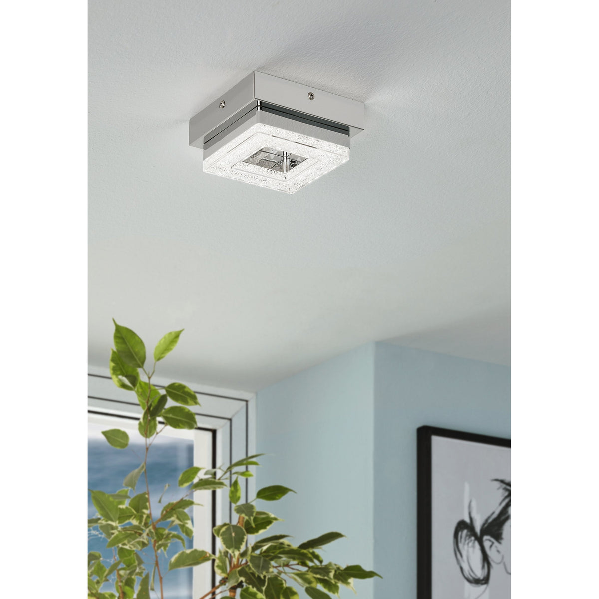 Jinelle LED Flush Ceiling Light in chrome with a square crystal-effect frame and mirrored centre, mounted on a white ceiling in a hallway setting.