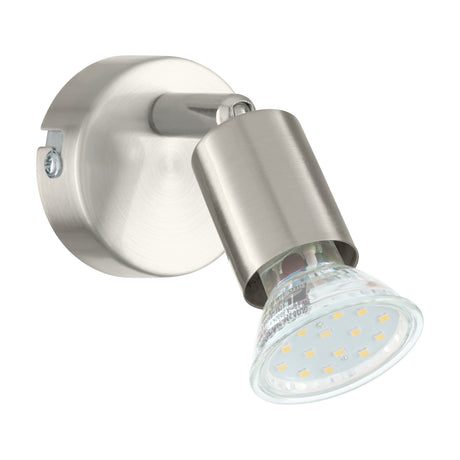 Josmanne Wall Spotlight in satin nickel, with a round steel backplate, pivoting knuckle, cylindrical head, and visible GU10 LED bulb, shown on a plain white background.