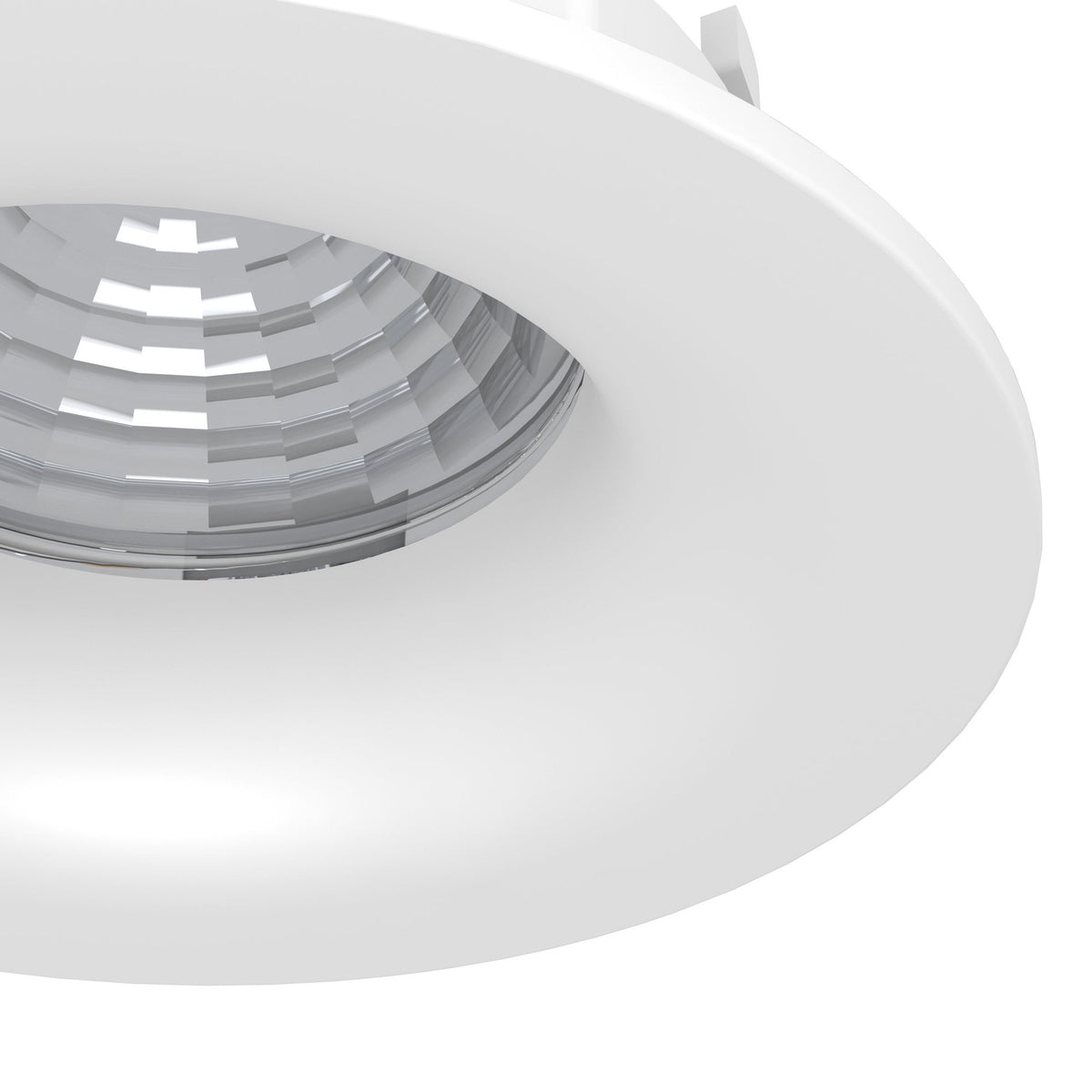 Kamarne LED downlight in white, close-up of the round aluminium body with a faceted reflector inside a smooth dished bezel, shown against a plain white background.