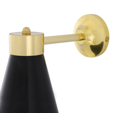 Kamina Cone Wall Light with a matt black tapered shade, polished brass collar, slim arm and round wall plate, shown close-up on a white background.