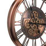 Kenema 53.5cm wall clock in antique copper metal, close-up showing open Roman numeral skeleton frame, exposed gear cluster on a studded dial, and black pointed hands, on a white background.