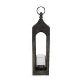 Kerteh Candle Lantern, a tall square aluminium lantern with arched open sides, pitched top, top ring handle, and a clear glass candle cylinder at its base, shown on a plain white background.