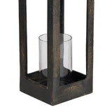 Close-up of the Kerteh Candle Lantern's square aluminium frame in distressed black, showing a clear glass cylinder insert on the base, against a plain white background.