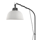 The Kinke Floor Lamp With Hook - Anthracite features a ribbed white dome shade, black curved stand, and visible cord, bringing contemporary style to any space.