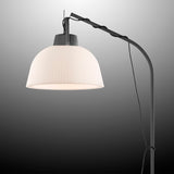 The Kinke Floor Lamp With Hook - Anthracite features a ribbed, dome-shaped white shade and a curved anthracite stand, shown against a gradient gray background.
