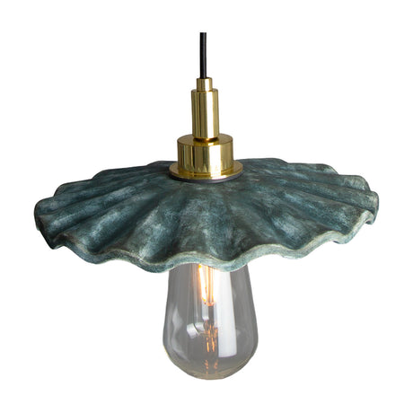 Kirhii ceramic pendant light with a wide ruffled shade in Blue Earth glaze, brass lampholder and cord, shown with exposed bulb on a plain white background.