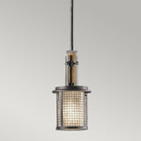 The Ahrendale 1 Light Mini Pendant in Grey showcases an industrial style with its cylindrical design. It includes a mesh metal casing and is suspended from a single rod, allowing the warm glow to diffuse through its frosted inner shade, capturing the essence of industrial-inspired lighting.