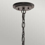 A black metal chain effortlessly suspends from a circular ceiling mount, delivering a simple, industrial design that enhances rustic elegance. This minimalist arrangement beautifully highlights the charm of the Ahrendale 3 Light Duo-Mount Chandelier - Grey against a plain, light gray background.