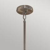 Close-up of the Aleeka 3 Light Chandelier in silver, ceiling-mounted with a hanging rod and attached to a circular metal plate on a light gray background, perfectly complementing any modern interiors.