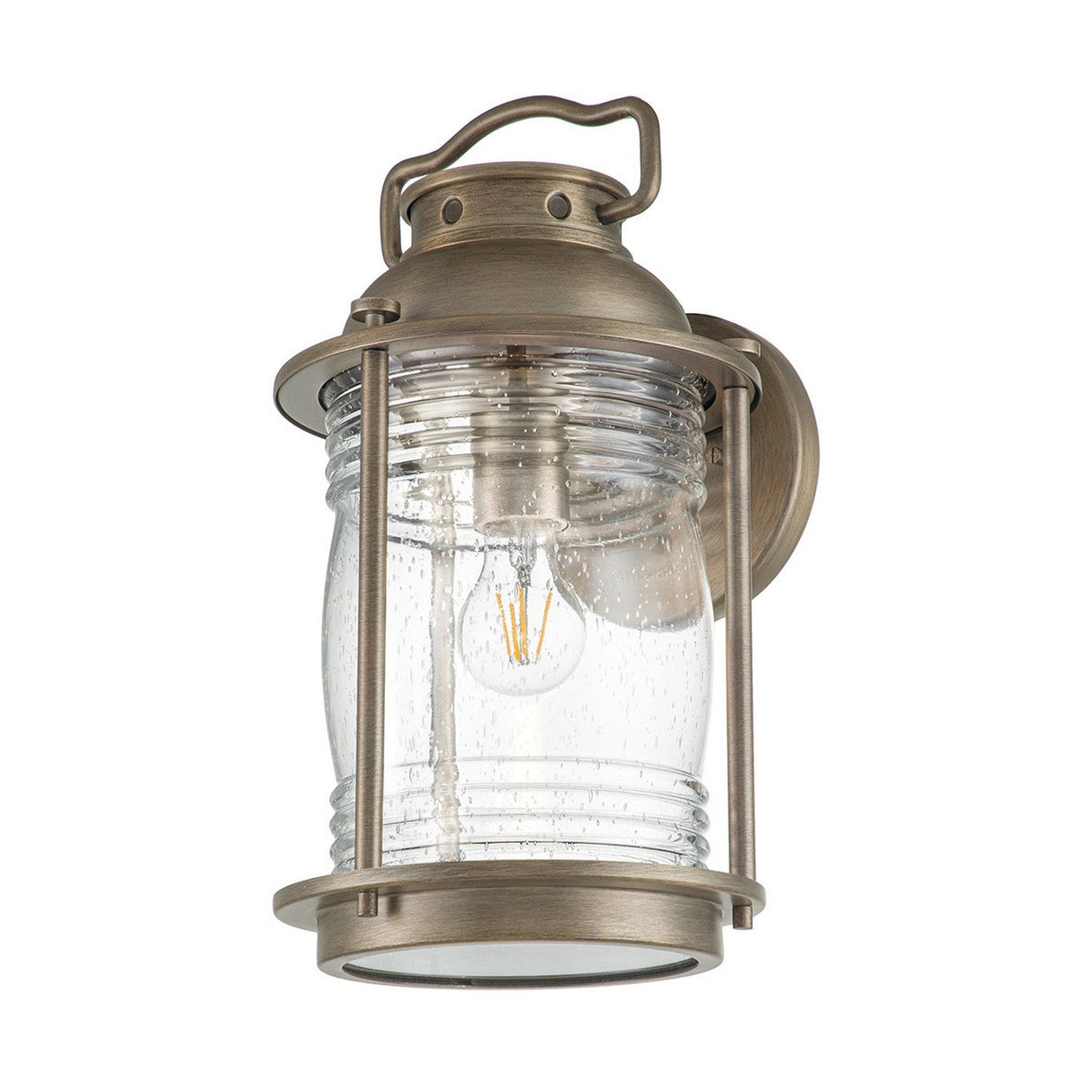 The Ashland Bay Outdoor 1 Light Large Wall Lantern - Burnished Bronze features a vintage-style design with a clear ribbed glass shade and an LED Edison-style bulb, elegantly mounted on a circular backplate.