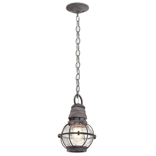 Introducing the Bridge Point Outdoor 1 Light Small Chain Light, featuring an industrial-style pendant design with a metal cage enclosing a clear glass bulb for nautical charm. This fixture hangs elegantly from a circular ceiling mount via a chain and displays a rustic, weathered zinc finish.