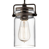 The Brinley 1 Light Mini Pendant - Bronze is a vintage-style hanging light fixture, ideal for rustic interiors, featuring a clear glass jar-shaped shade with a visible Edison bulb, elegantly suspended by a black and bronze pendant frame.