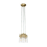 The Brinley 3 Light Pendant - Brushed Brass showcases a contemporary style with three clear glass shades hanging from braided cords connected to a brushed brass canopy, each housing a visible bulb to accentuate its industrial charm.