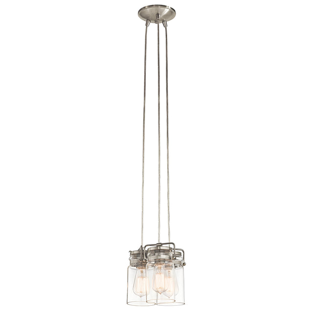 Introducing the Brinley 3 Light Pendant - Brushed Nickel, a vintage-inspired fixture featuring a brushed nickel finish. This modern design includes three hanging mason jar-style glass shades that elegantly display exposed bulbs. With its metal base and sleek supporting wires, it masterfully combines classic charm with contemporary flair.
