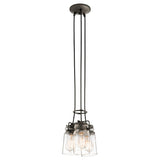 The Brinley 3 Light Pendant - Bronze exudes vintage charm with its three exposed bulbs enclosed in clear glass shades, elegantly suspended by black cords from a round ceiling mount.