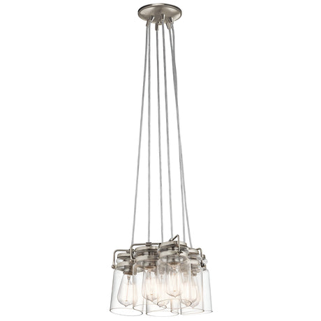 The Brinley 6 Light Pendant - Brushed Nickel features multiple clear glass shades suspended from sleek metal rods, exposing the bulbs inside. Its design merges contemporary style with a touch of vintage charm.
