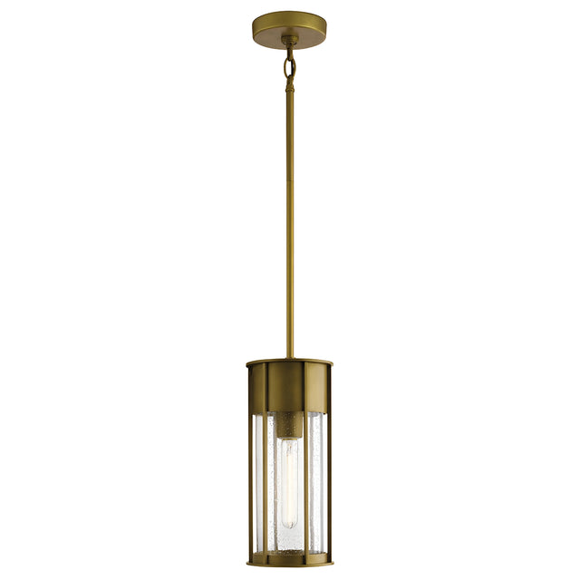 The Camillo Outdoor 1 Light Pendant in natural brass showcases a cylindrical design with clear seeded glass encasing a single vertical bulb. It boasts a sleek, modern appearance and is suspended by a long natural brass rod with a circular ceiling mount.