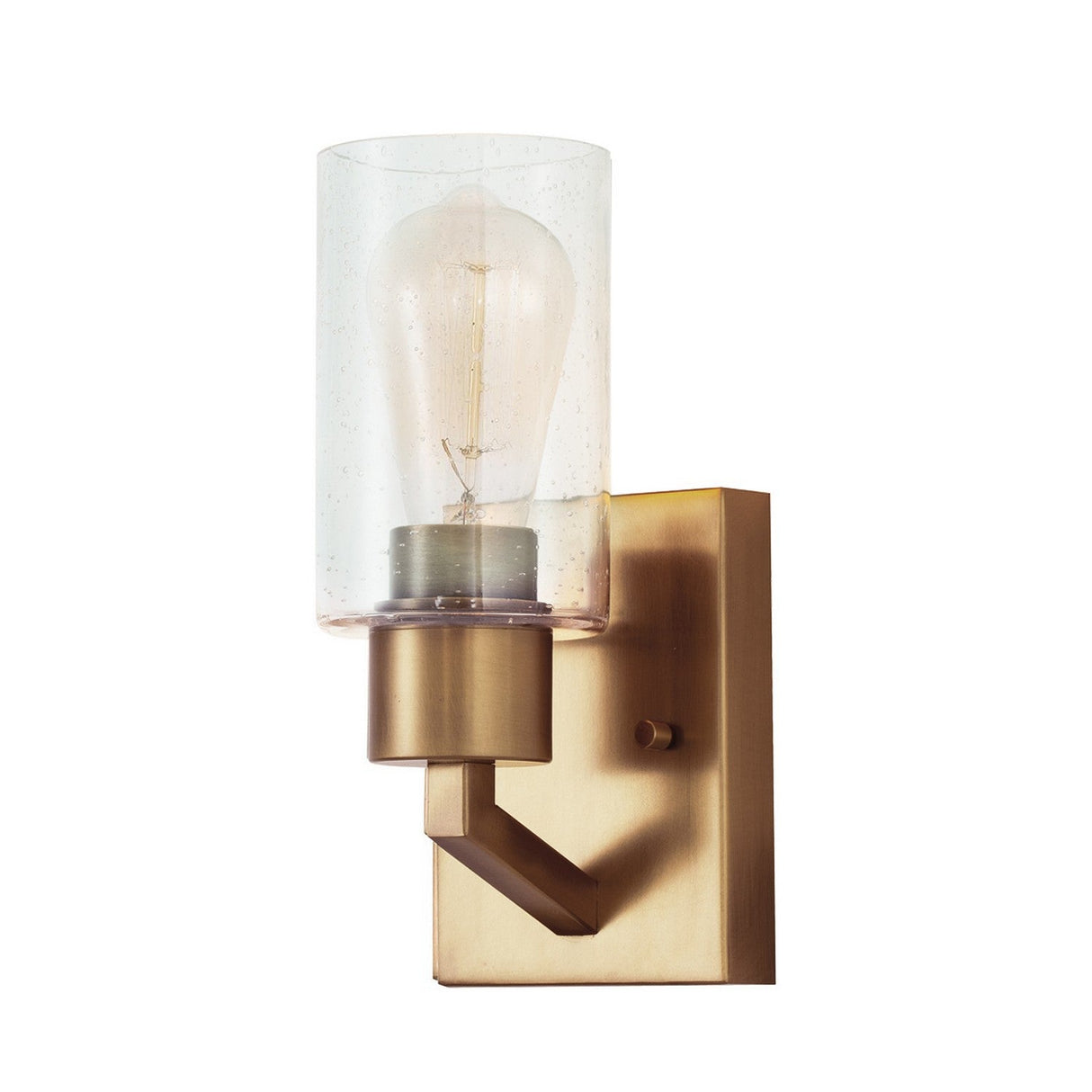 The Deryn 1 Light Wall Light in natural brass showcases a modern design with a vintage flair, featuring a rectangular base and an upward-facing seeded glass shade that reveals the light bulb. It's perfect for rustic decor and complements various interior styles.