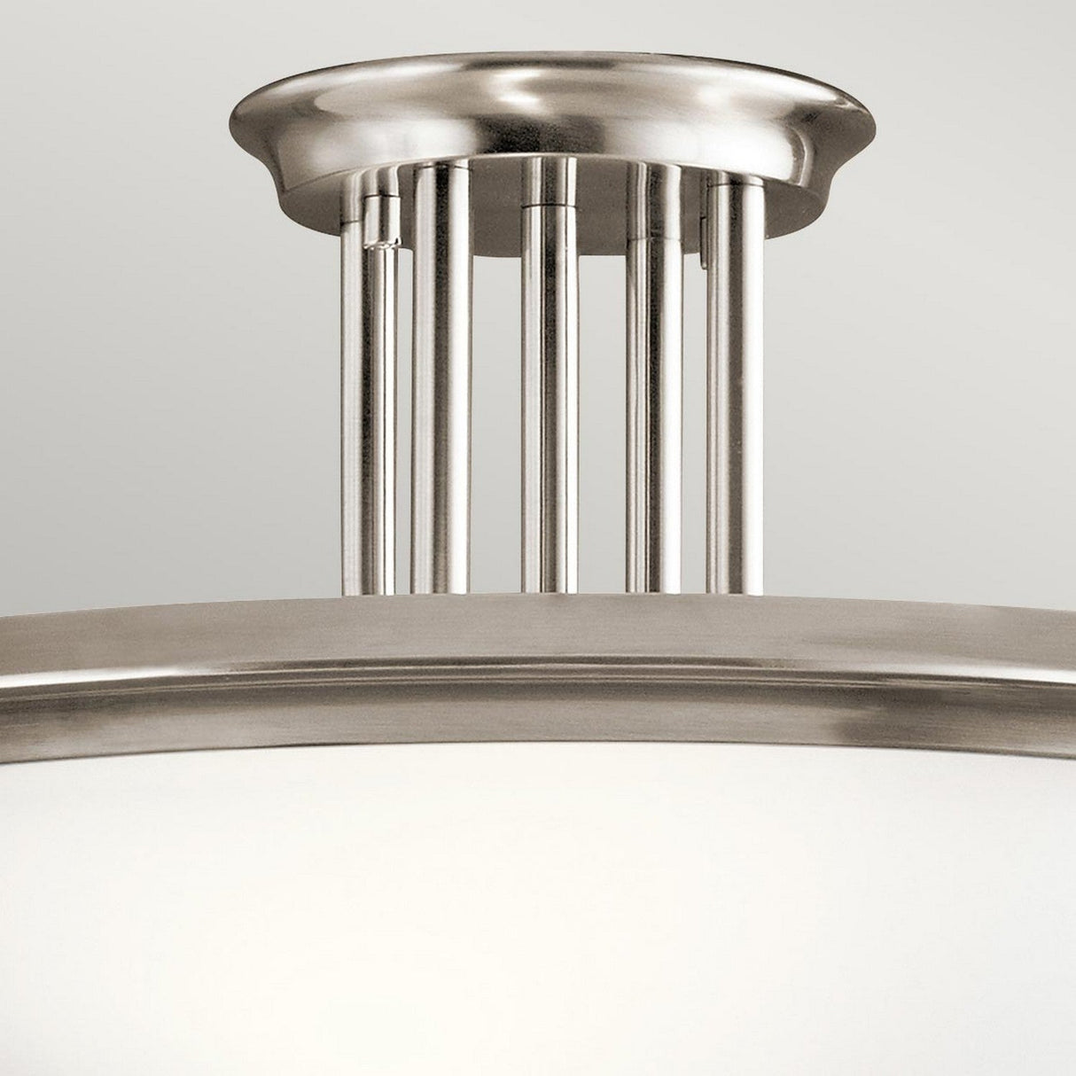 Presenting the Dreyfus 3 Light Semi Flush - Silver, a modern marvel of elegance. This brushed nickel fixture features a round white glass shade, complemented by stylish vertical metal rods and an optical crystal accent that enhances its sophisticated design.