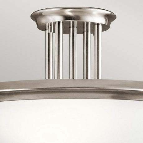 Presenting the Dreyfus 3 Light Semi Flush - Silver, a modern marvel of elegance. This brushed nickel fixture features a round white glass shade, complemented by stylish vertical metal rods and an optical crystal accent that enhances its sophisticated design.