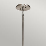 Featuring a sleek design, the Emory 4 Light Duo-Mount Chandelier in silver showcases a metal ceiling mount with a semi-flush style. It includes a rod suspended from a circular base, securely attached with screws against a neutral gray backdrop. The fixture exudes an incomplete look, hinting at its role as part of an elegant chandelier lighting solution.