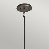 A close-up view of the Emory 4 Light Duo-Mount Chandelier in Olde Bronze displays a rod attached to a round base. The rod is secured with two screws and a loop, set against a plain gray background, highlighting the classic elegance of its design.