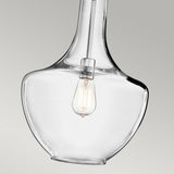 The Everly 1 Light Medium Pendant in Chrome, featuring a clear glass shade and vintage-style LED filament bulb, is set against a plain grey background to highlight its modern and minimalist design.