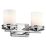 The Hendrik 2 Light Wall Light - Polished Chrome is a contemporary fixture featuring two frosted glass shades and a polished chrome base, accented by sleek circular designs. Its symmetrical and modern style makes it ideal for bathroom lighting or enhancing any hallway.