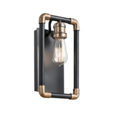 The Imahn 1 Light Wall Light - Black & Natural Brass is a modern wall sconce showcasing an exposed Edison-style bulb. It features a rectangular black frame with elegant brass accents at the corners and a sleek metallic backplate, blending industrial and contemporary styles in a minimalist design.