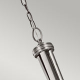 The Lacey 4 Light Large Pendant - Silver is a modern metallic silver fixture characterized by its vertical slats and a round top attached to a chain. Its striking, sleek double-shade design contrasts beautifully against the simple light gray background.