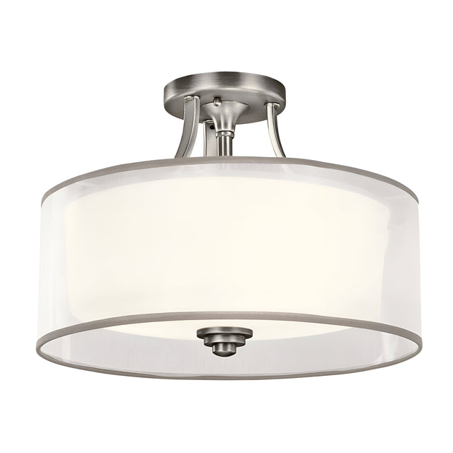 Product Description: The Lacey 3 Light Small Semi Flush – Silver is a ceiling-mounted contemporary light fixture featuring a frosted glass drum shade with metallic accents and a circular design. It emits a layered glow and comes with a polished silver finish.