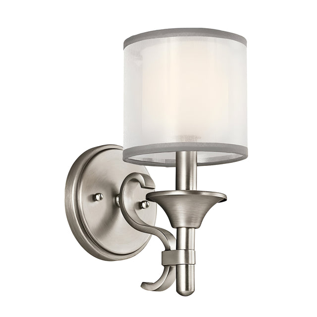 Introducing the Lacey 1 Light Wall Light in Silver, a modern wall-mounted fixture with a satin nickel finish and timeless design. It boasts a curved arm and a double shade featuring frosted cylindrical glass, offering a sleek, contemporary aesthetic.