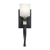 The Marette 1 Light Wall Light - Black and Nickel is a wall-mounted fixture featuring a sleek black metal base and a curved nickel arm. It includes a square opal glass shade that provides even light diffusion, offering an elegant modern design perfect for contemporary home decor.