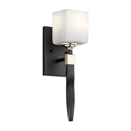 Introducing the Marette 1 Light Wall Light - Black and Nickel, featuring a sleek black base and a gracefully curved arm that supports an opal glass, cube-shaped lampshade. This design elegantly combines contemporary and minimalist styles, making it an ideal choice for enhancing both residential and commercial interiors.