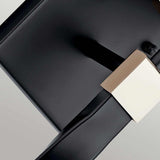 Close-up of the Marette 1 Light Wall Light in black with a nickel finish. The design is minimalist, enhancing the contrast between materials and colors. The background, resembling opal glass, showcases a subtle gradient that highlights the wall light's contemporary design aesthetic.