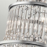 A close-up of the Piper 18 Light Chandelier in polished chrome showcases its elegant design, featuring multiple layers of hanging crystal rods and clear glass bead accents. Its frame beautifully reflects light, enhancing the chandelier's allure.