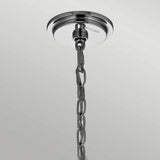 A ceiling mount in polished chrome holds a silver metallic chain adorned with delicate glass bead accents, twinkling against a simple, light backdrop, echoing the sophisticated Piper 6 Light Chandelier - Polished Chrome.