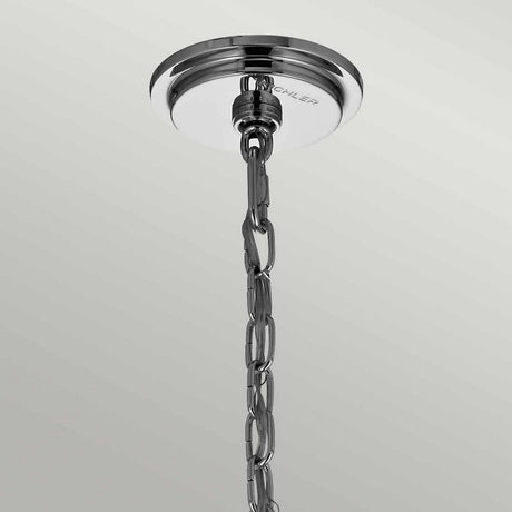 A ceiling mount in polished chrome holds a silver metallic chain adorned with delicate glass bead accents, twinkling against a simple, light backdrop, echoing the sophisticated Piper 6 Light Chandelier - Polished Chrome.