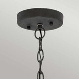 Close-up of the Riverwood Outdoor 1 Light Chain Pendant, featuring a ceiling-mounted round metal base with a weathered zinc finish. Two visible screws secure the base, and a chain resembling nautical pendant light fixtures with interlocking oval links is suspended in front of a light gray background.