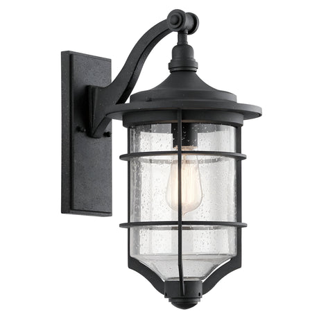 The Royal Marine Outdoor 1 Light Medium Wall Lantern - Black showcases a black metal frame paired with clear, textured glass. Featuring a vintage-style bulb within and mounted on a rectangular base, this lantern exudes a classic nautical-inspired look that adds timeless charm to your outdoor lighting.