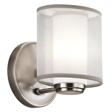 The Saldana 1 Light Wall Light in silver features a modern design, complete with an opal glass shade and a brushed silver finish mount, providing a soft white illumination.