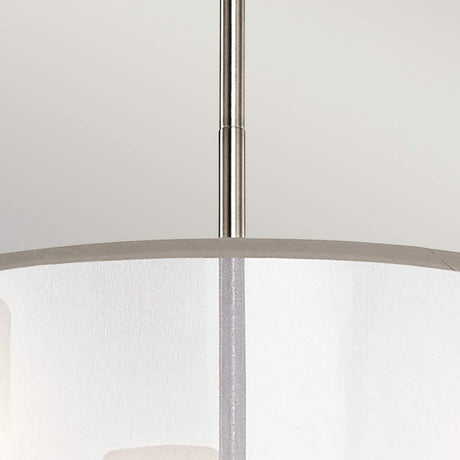 A close-up of the Saldana 3 Light Chandelier - Silver showcases its graceful organza shade and polished metallic rod, beautifully contrasted against a light gray background.